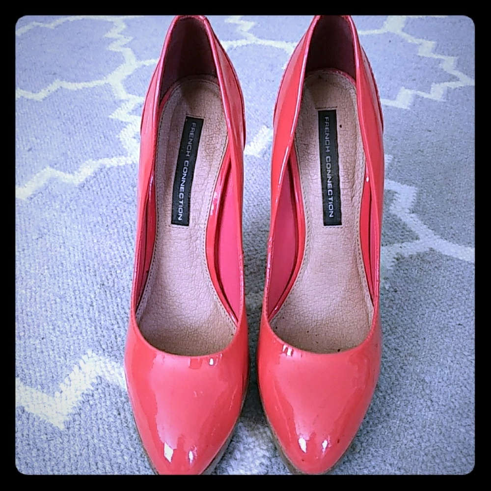 These pumps are patent orange four plus inch heels